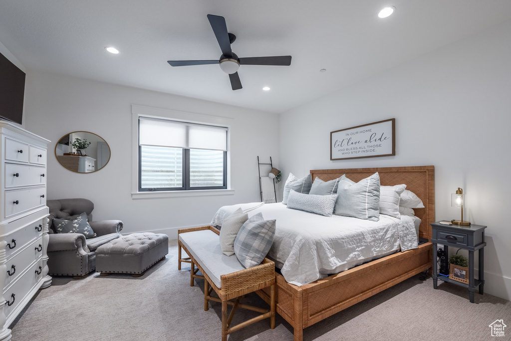 Bedroom featuring light colored carpet, recessed lighting, and ceiling fan
