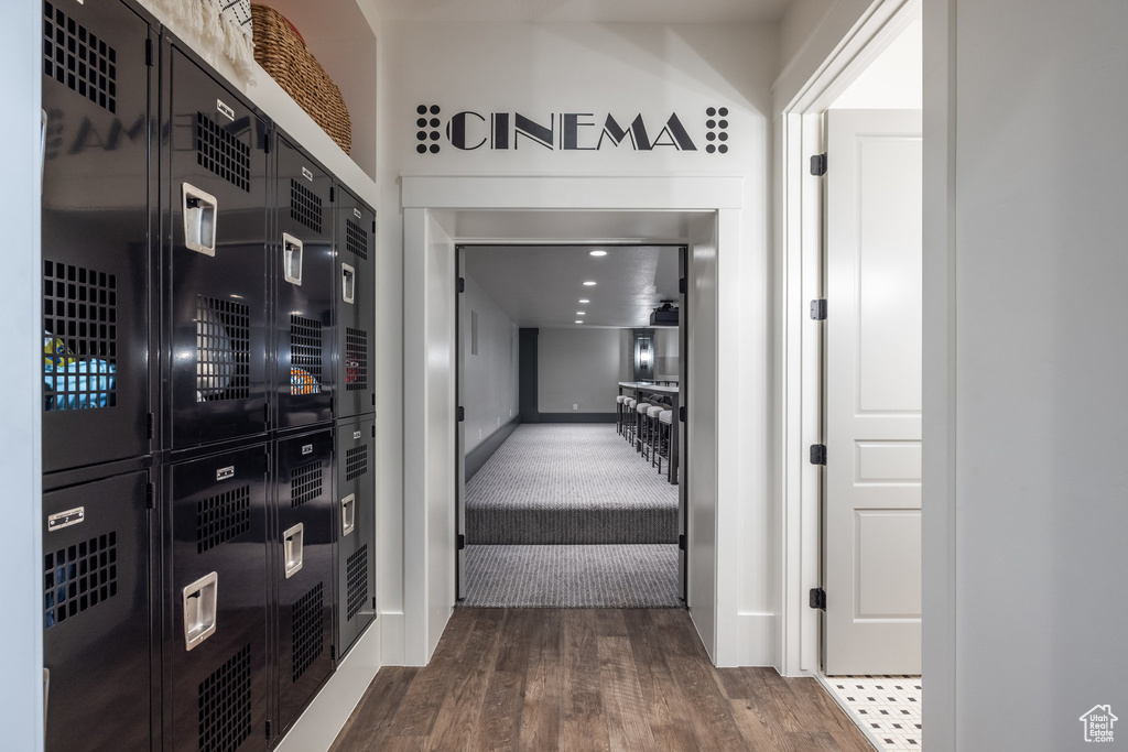 Corridor with wood finished floors and baseboards