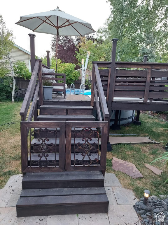 Deck featuring an outdoor pool