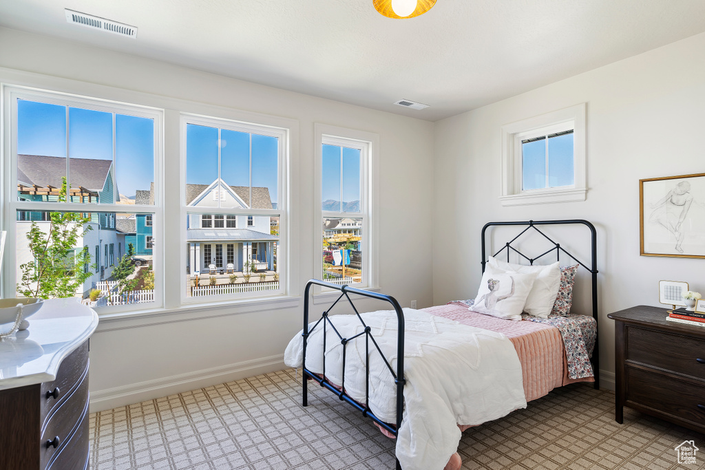 Bedroom featuring visible vents and baseboards