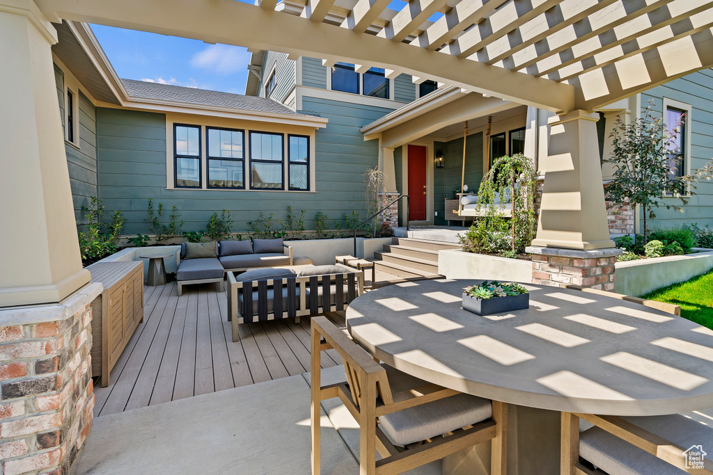 View of patio / terrace with outdoor dining area, outdoor lounge area, a deck, and a pergola