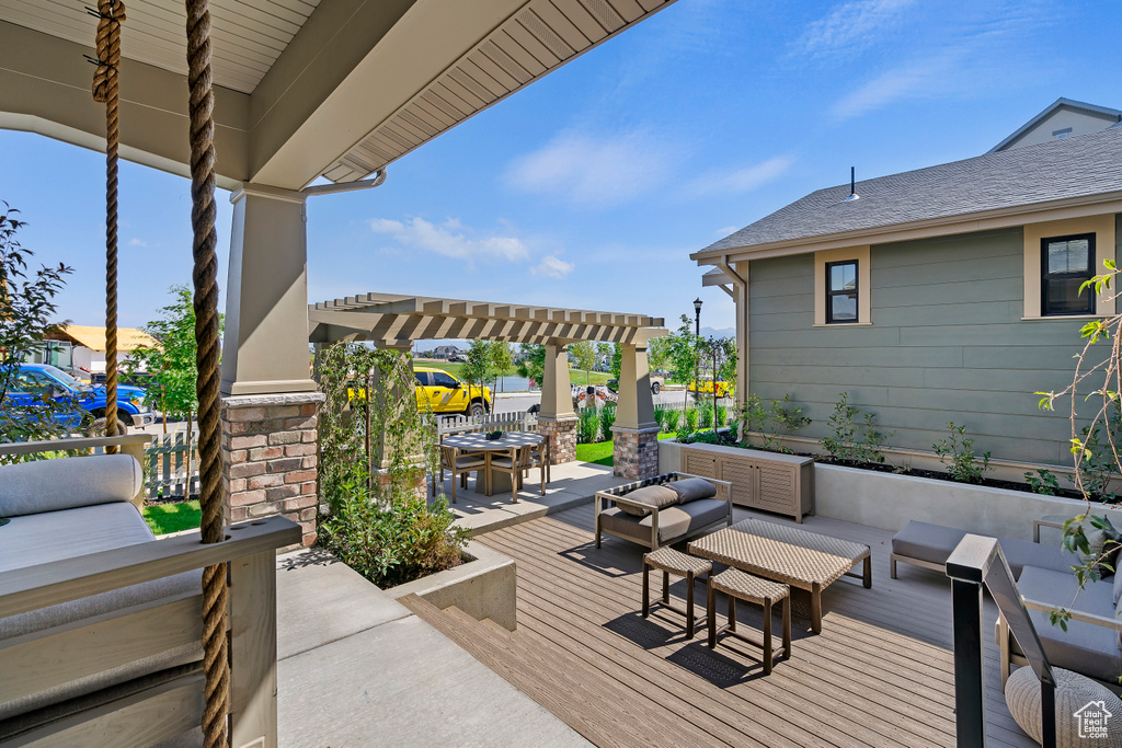 View of patio / terrace with a deck, outdoor dining area, an outdoor living space, and a pergola