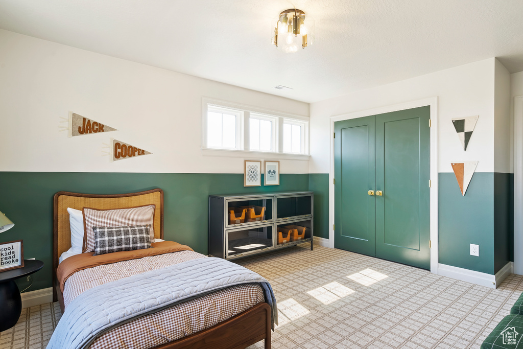 Bedroom featuring a closet, visible vents, and baseboards