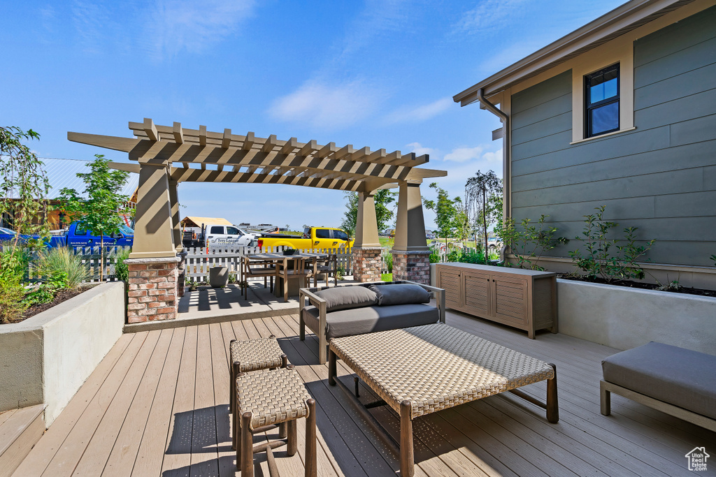 Deck featuring a pergola
