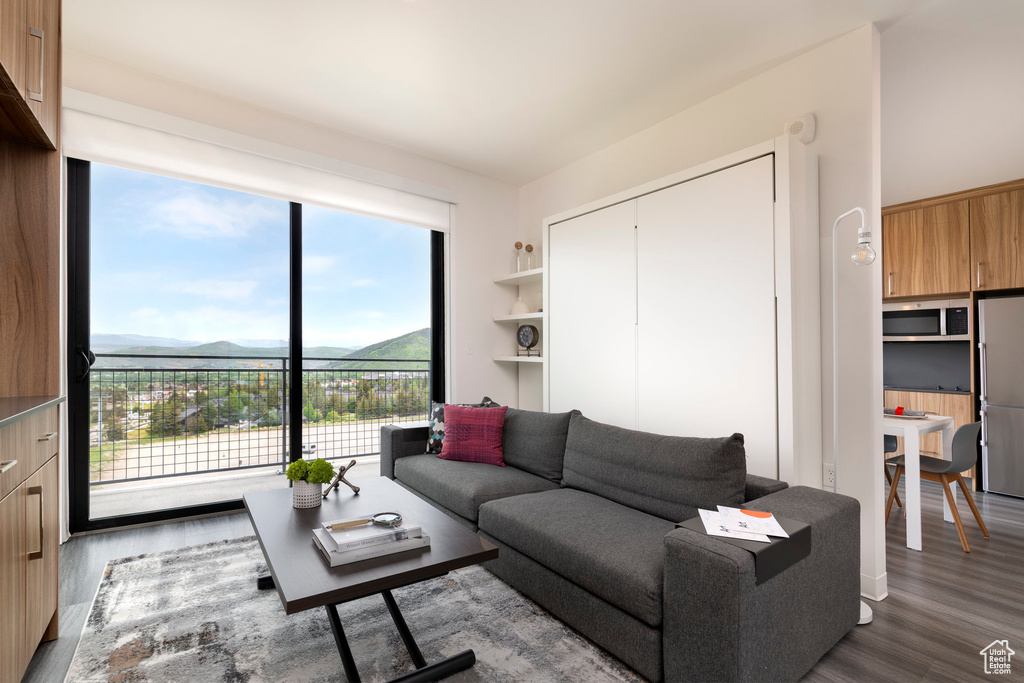 Living room featuring wood finished floors and a mountain view