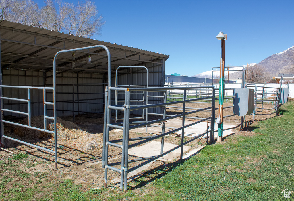 View of outdoor structure featuring an exterior structure, a mountain view, and an outdoor structure