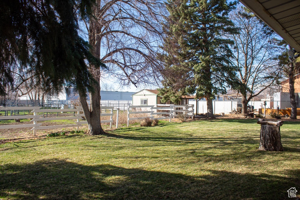 View of yard featuring fence