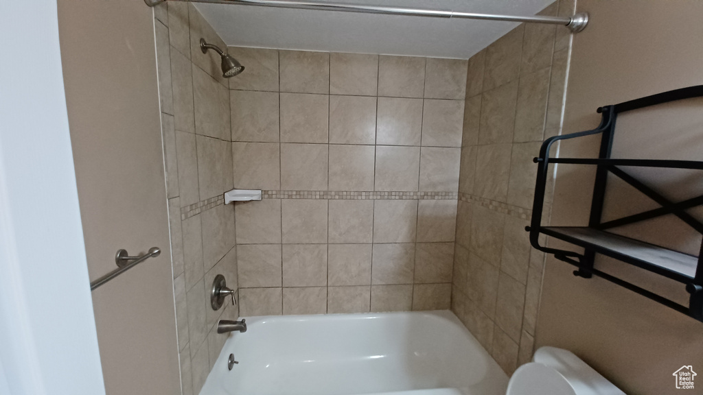 Full bath with shower / tub combination and toilet