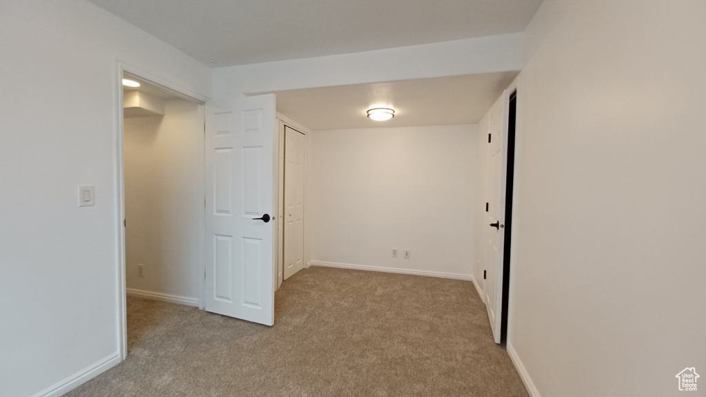 Basement with carpet and baseboards