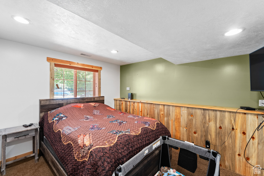 Bedroom with carpet flooring, recessed lighting, baseboards, and a textured ceiling