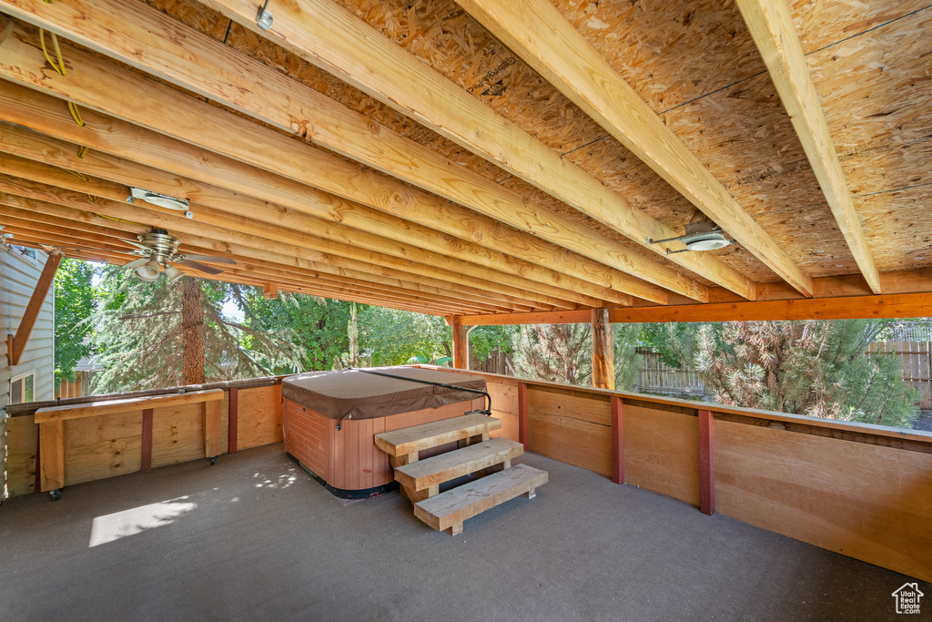 View of patio with a hot tub