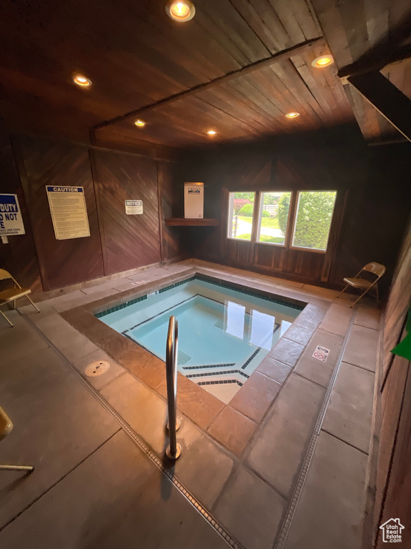 View of pool with a swimming pool and a hot tub