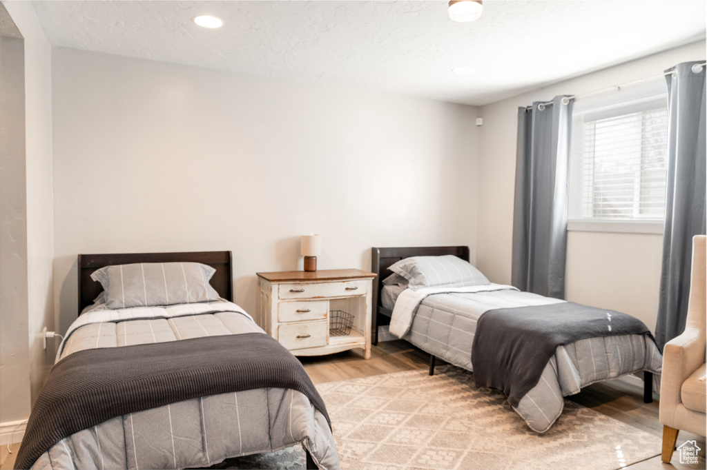Bedroom featuring light wood finished floors and recessed lighting