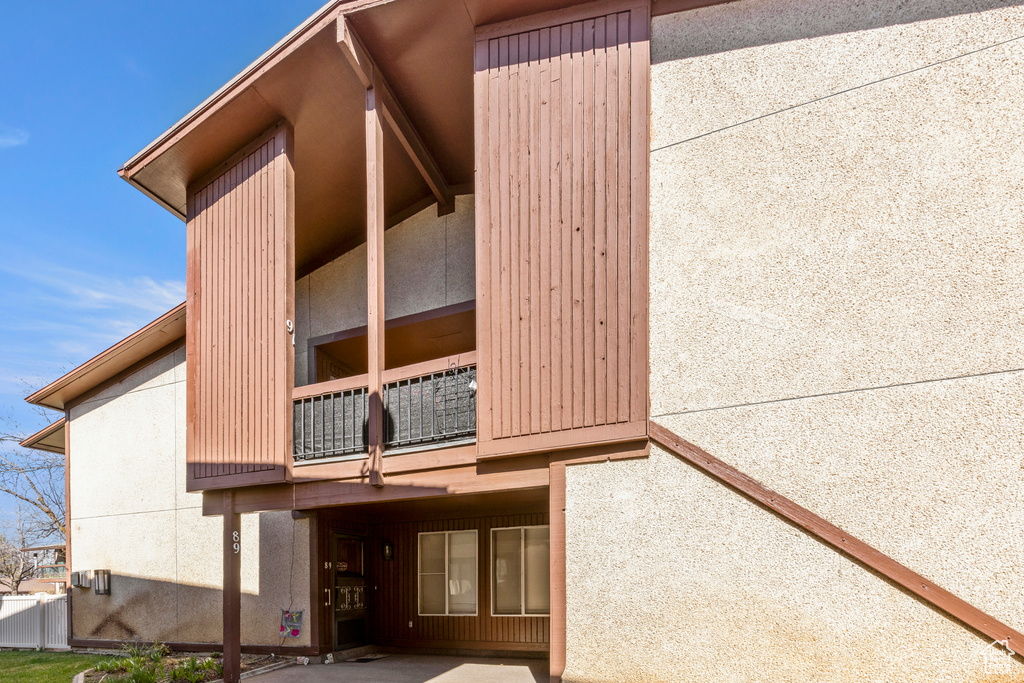 Exterior space featuring stucco siding