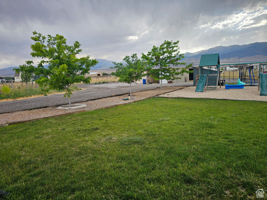 View of grassy yard featuring a mountain view