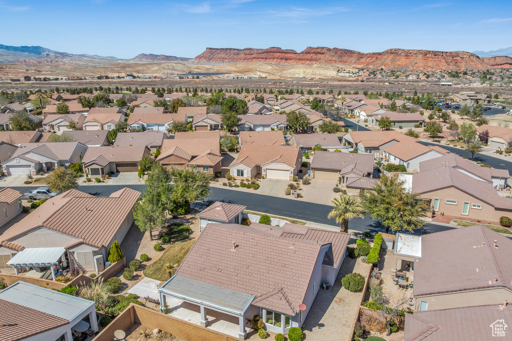 Aerial perspective of suburban area with a mountain backdrop