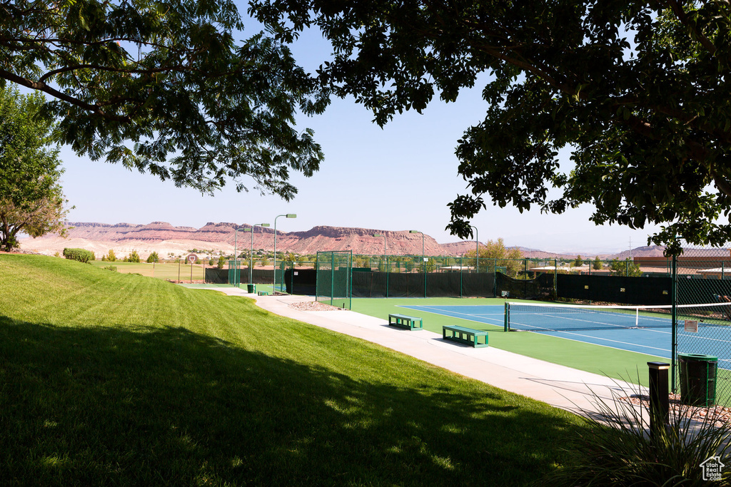 View of tennis court featuring a mountain view