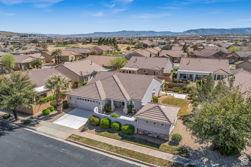 Aerial view of residential area with a mountainous background