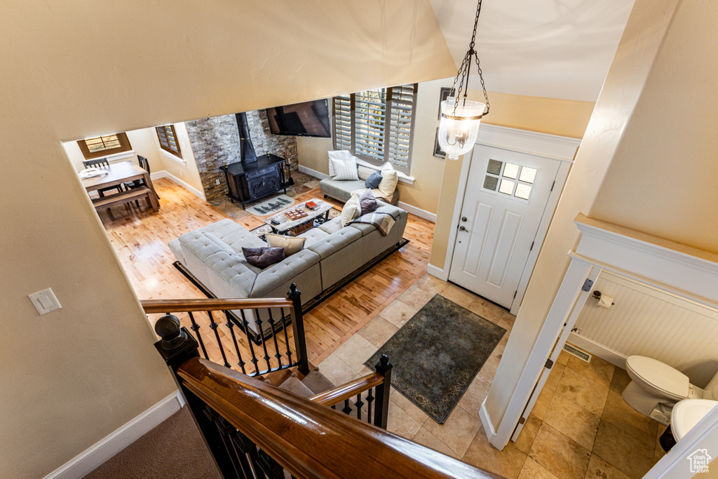 Living area with a wood stove and baseboards