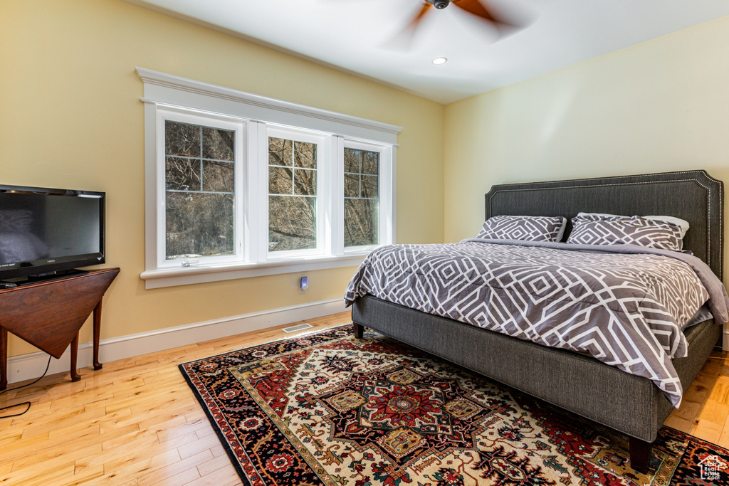 Bedroom featuring wood finished floors and a ceiling fan