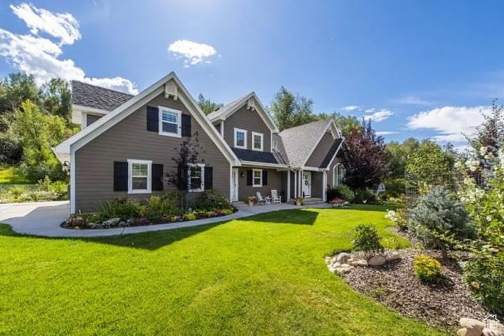Back of property with a yard