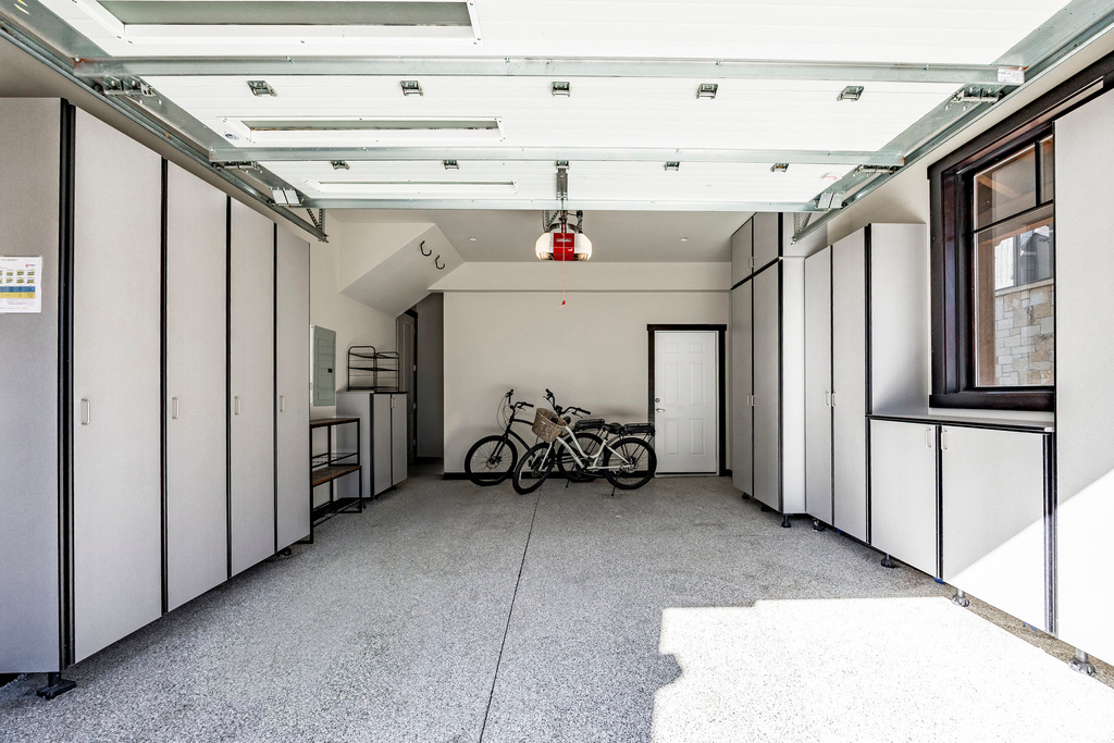 Garage featuring a garage door opener