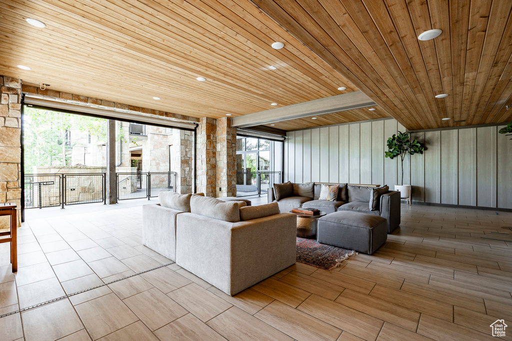 Living room featuring wooden ceiling and recessed lighting