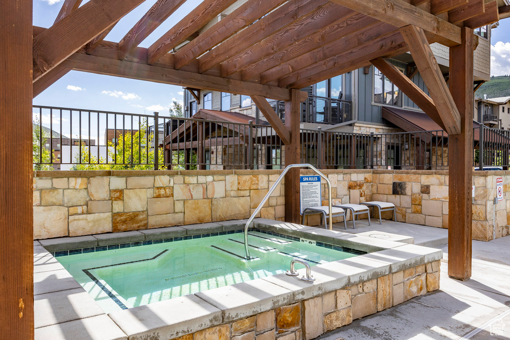 View of pool featuring a community hot tub