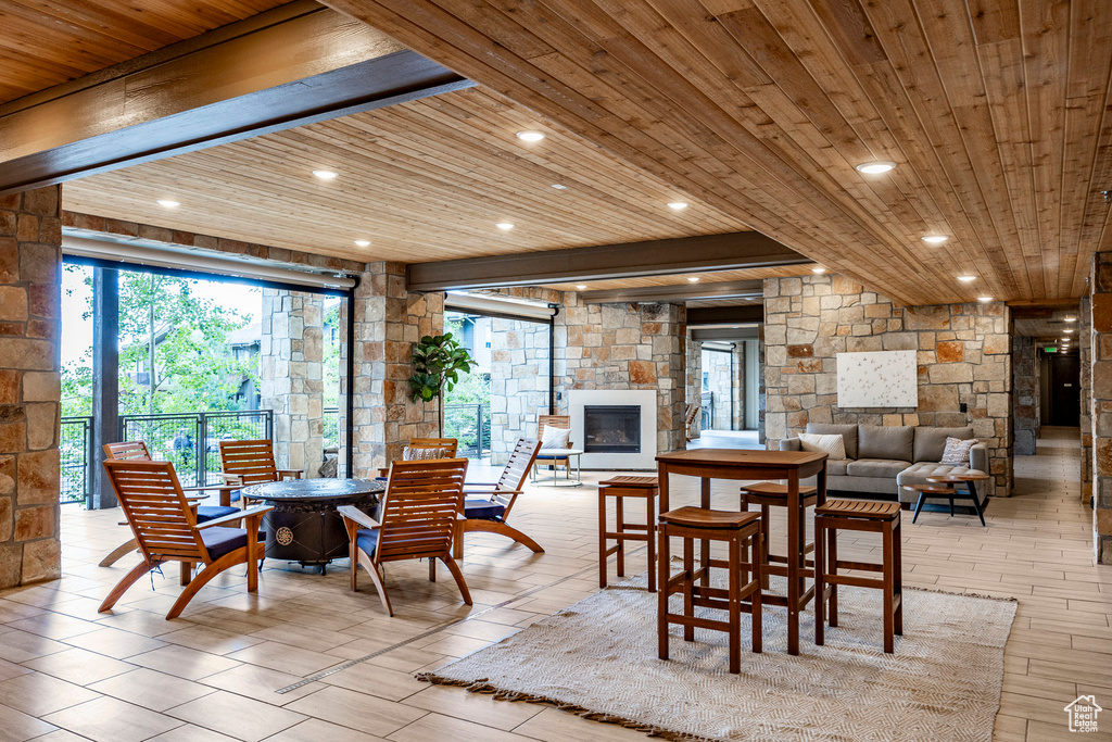 Dining space with beamed ceiling, recessed lighting, and wood ceiling