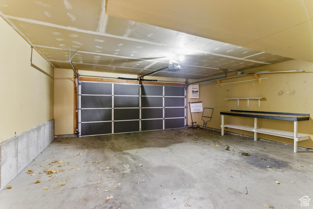 Garage featuring a garage door opener