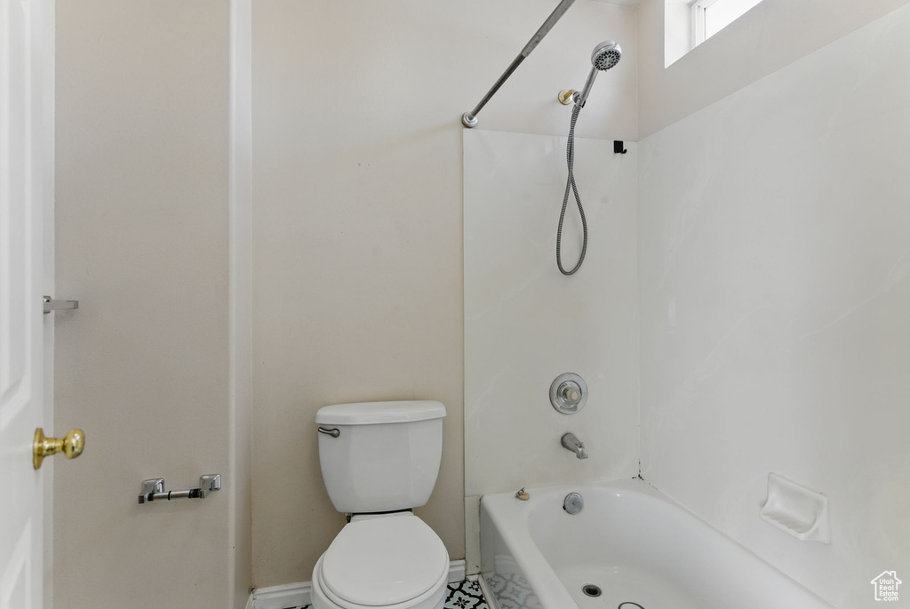 Full bathroom featuring bathtub / shower combination and toilet