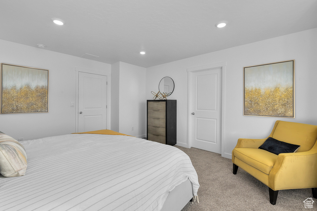 Bedroom with baseboards, light colored carpet, and recessed lighting