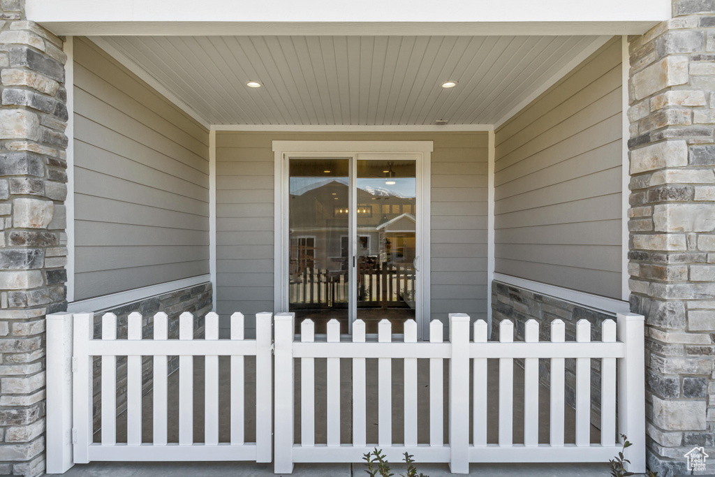 Property entrance with stone siding