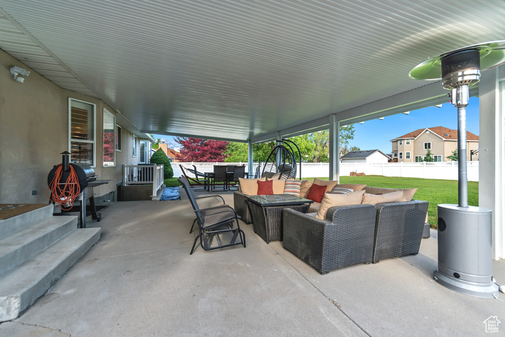 View of patio featuring outdoor dining area and an outdoor hangout area