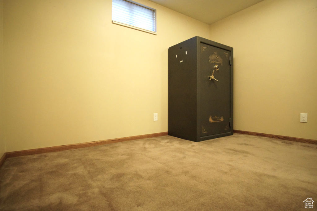 Below grade area with baseboards and carpet flooring