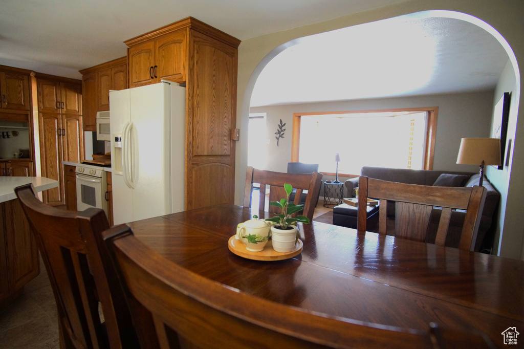 Dining space featuring arched walkways