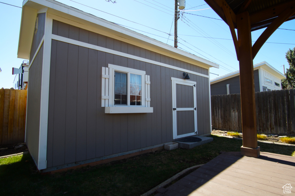 View of outdoor structure featuring an outbuilding and fence private yard