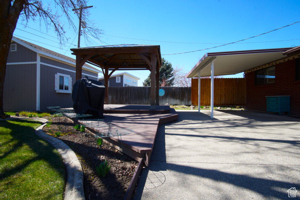 View of patio / terrace featuring a carport, area for grilling, and fence