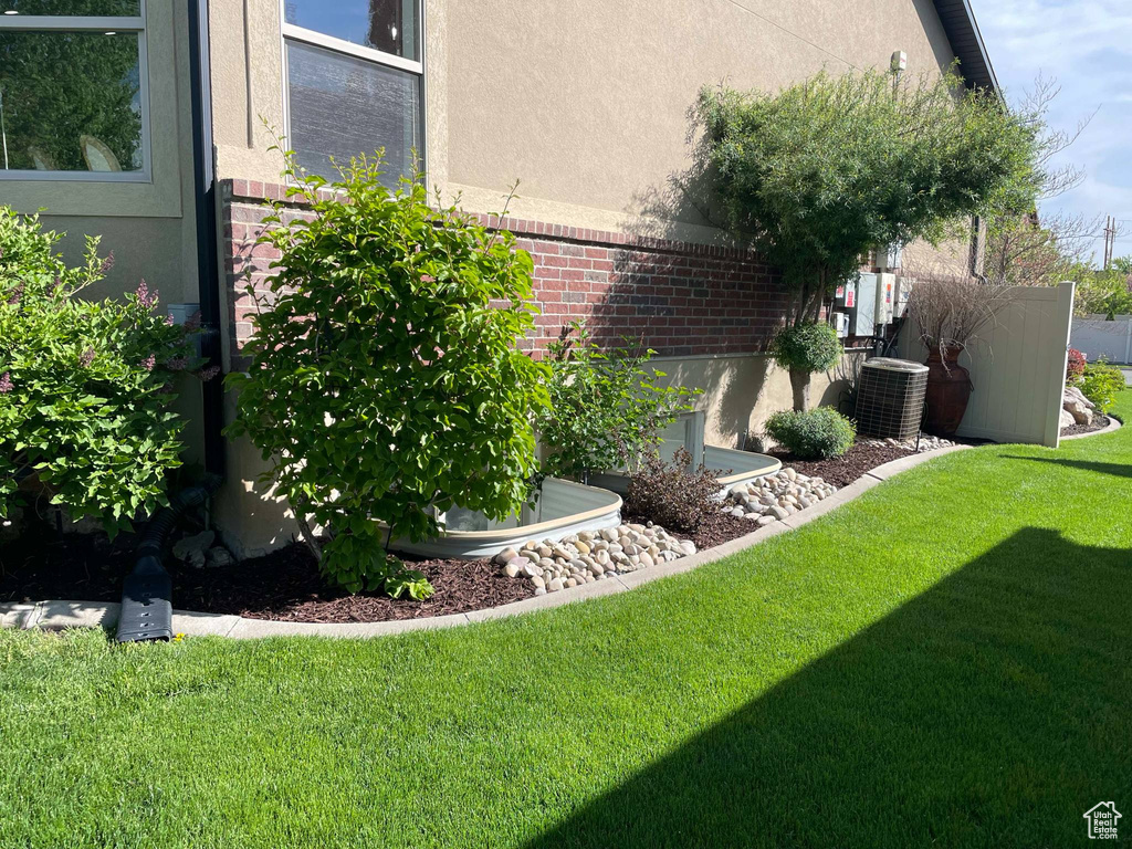 View of yard featuring central AC unit
