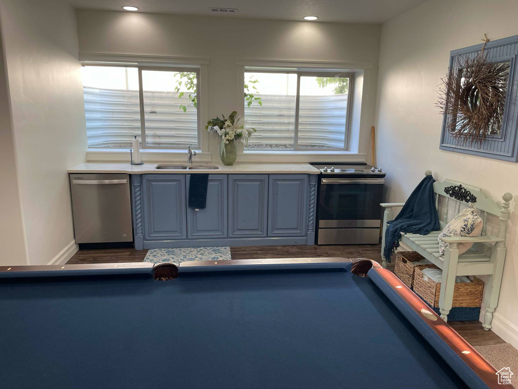 Interior space with pool table, plenty of natural light, and a sink