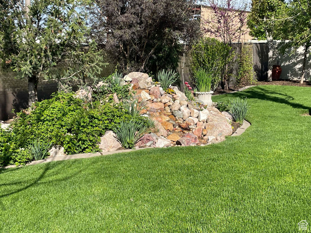 View of yard featuring fence