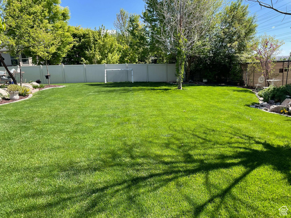 View of yard with a fenced backyard