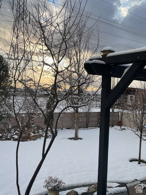 View of yard layered in snow