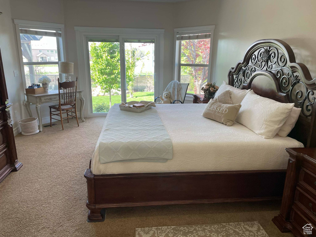 Bedroom featuring carpet flooring and access to outside