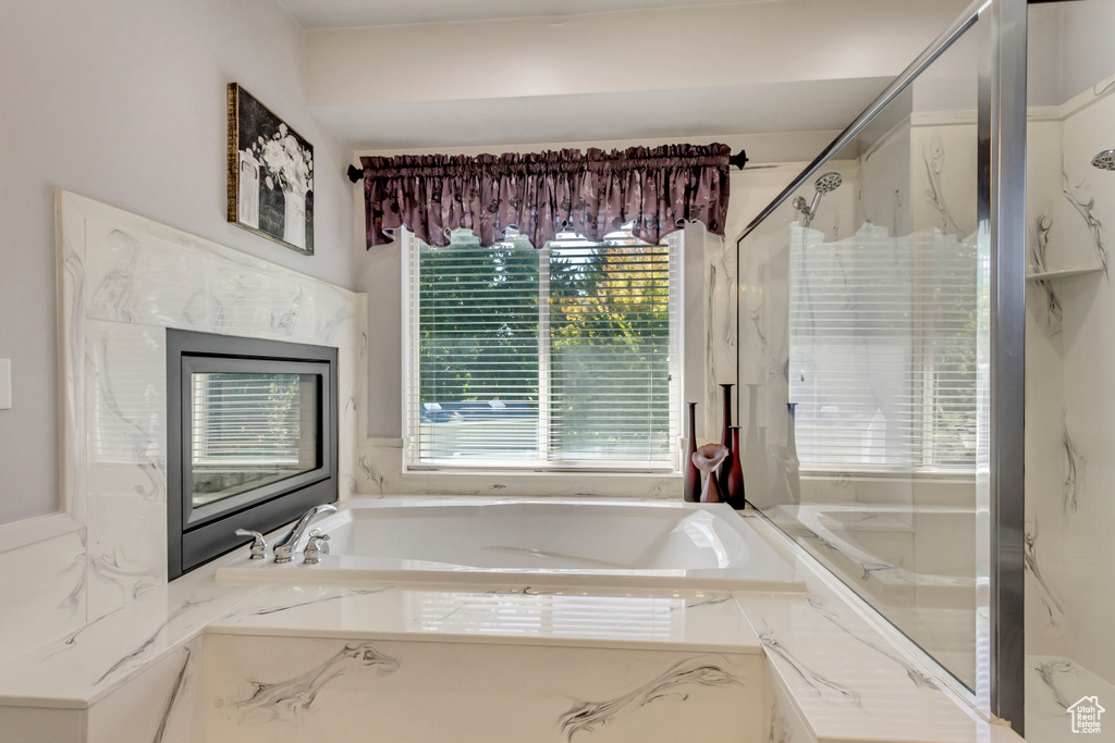 Full bath featuring a garden tub