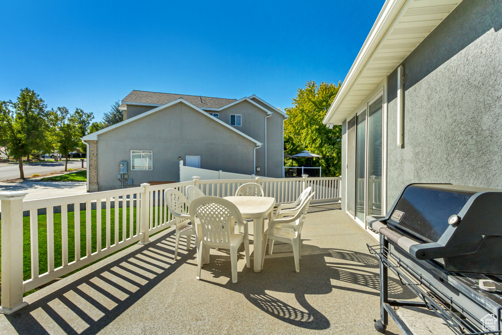 View of patio with grilling area and outdoor dining space