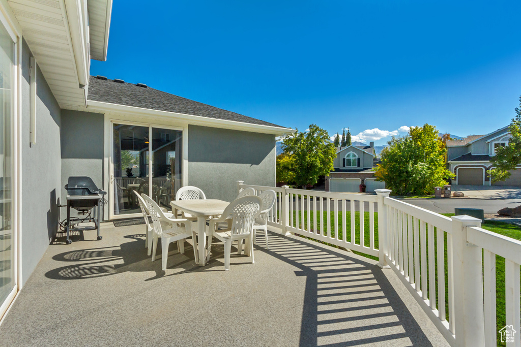 View of patio featuring grilling area and outdoor dining area