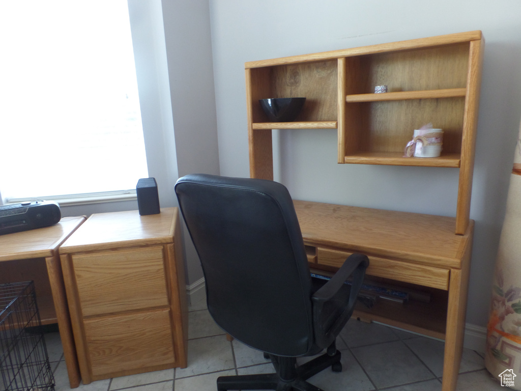 Office space featuring light tile patterned floors