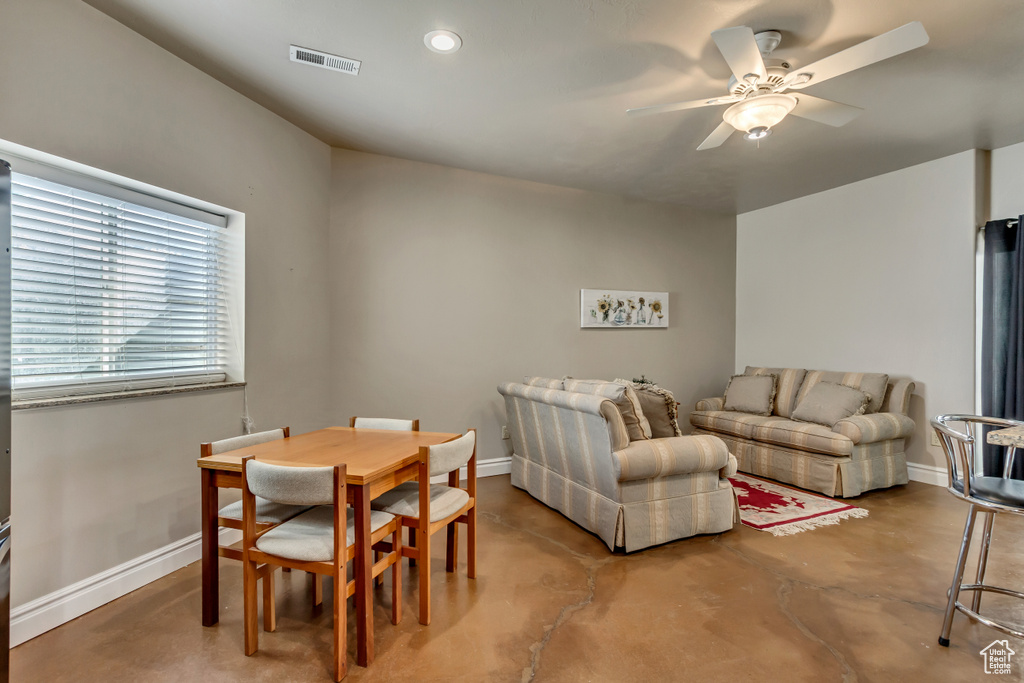 Dining space featuring visible vents, baseboards, recessed lighting, a ceiling fan, and concrete flooring