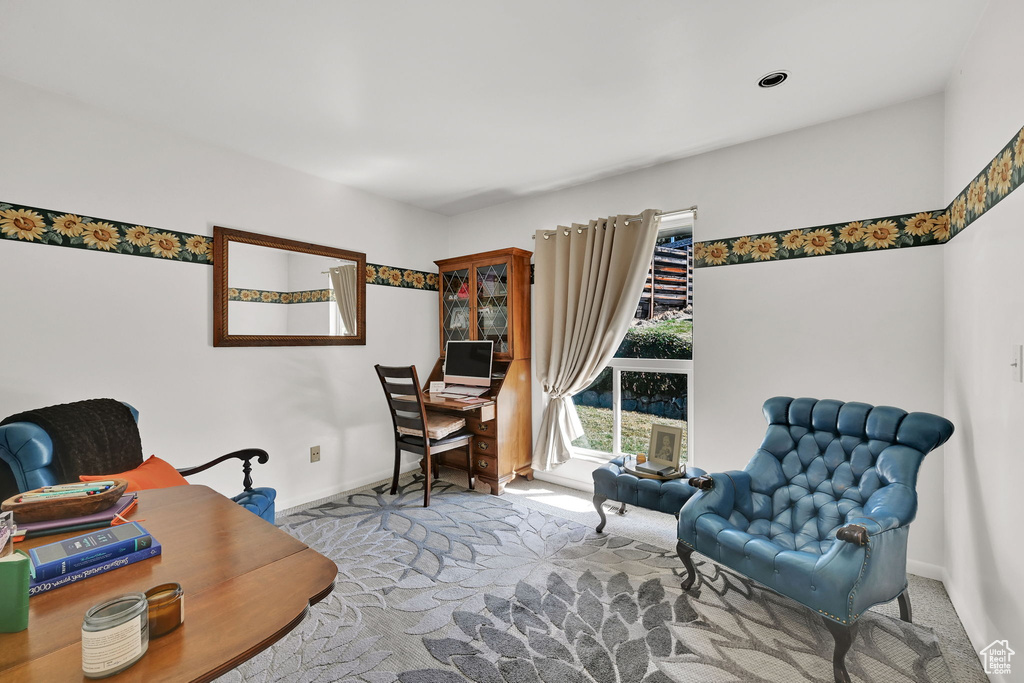 Office area featuring carpet floors and baseboards
